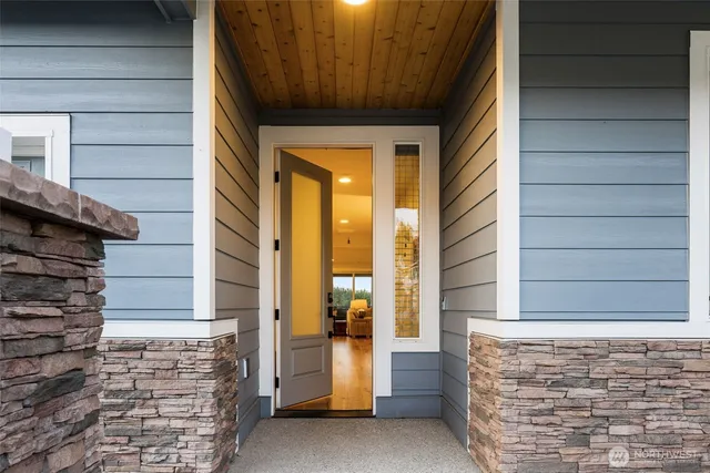a view of front door of house with stairs