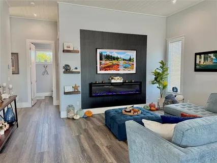 a bathroom with a sink a toilet and a large mirror
