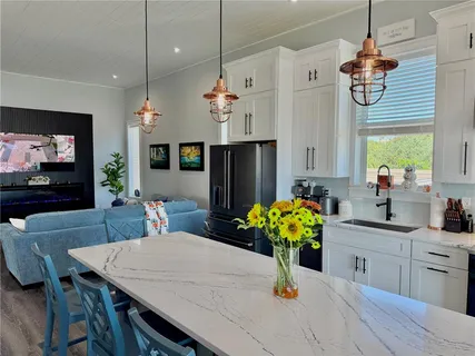 a bathroom with a sink a mirror and a window