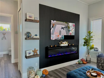 a bathroom with a shower and a wooden door