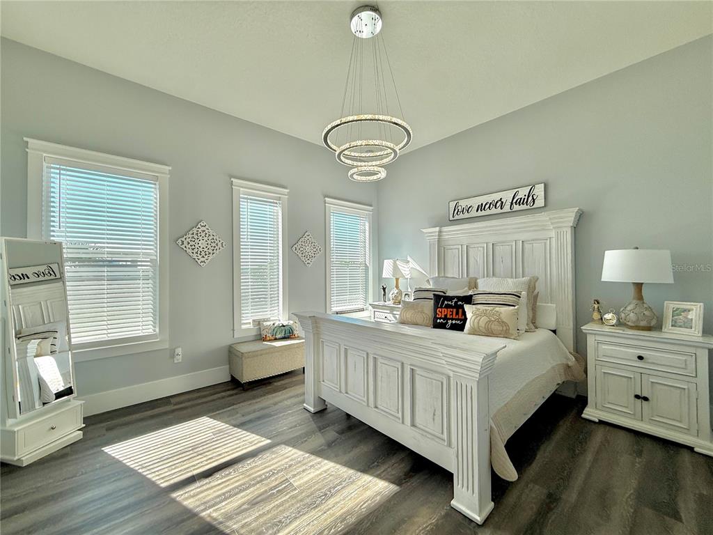 304 North 7th Street Flagler Beach, FL 32136 - Photo 28 of 89 a bedroom with a bed and wooden floor