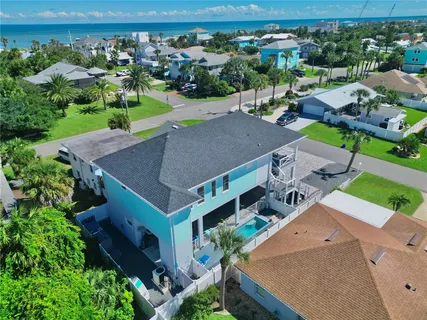 an aerial view of a house with a garden