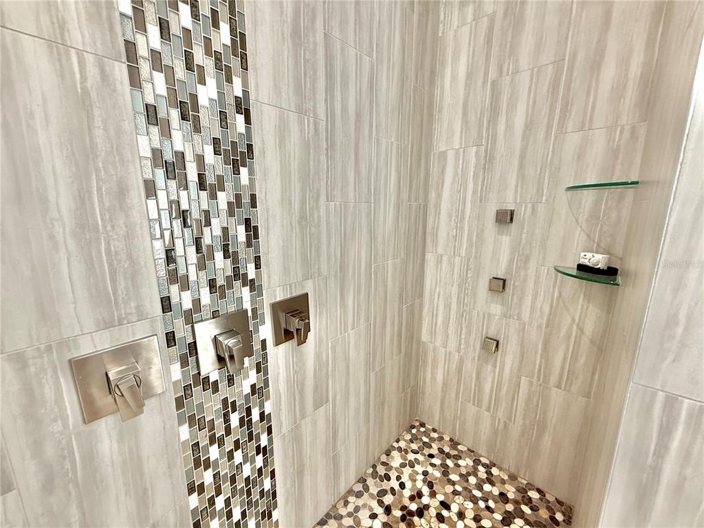 304 North 7th Street Flagler Beach, FL 32136 - Photo 40 of 89 a bathroom with a shower curtain