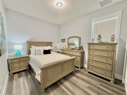 a bathroom with a sink a mirror and vanity
