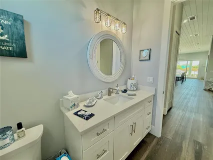 a view of a backyard with furniture and floor to ceiling window