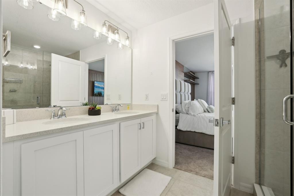646 Longboat Drive Davenport, FL 33896 - Photo 11 of 41 a en suite bathroom with a double sink and mirror