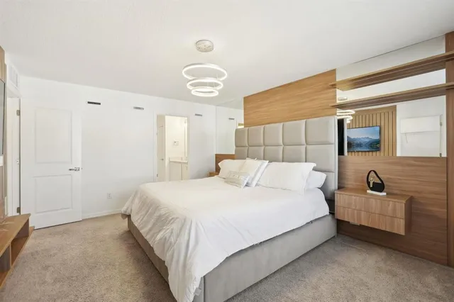 a bedroom with a bed and a couch