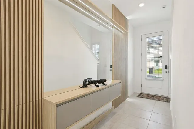 a room with a sink and a mirror