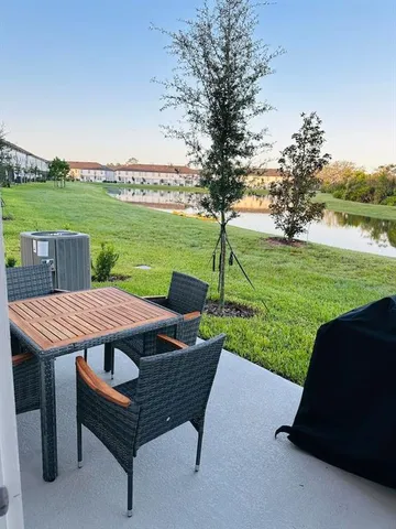 a view of a sitting area with furniture and garden
