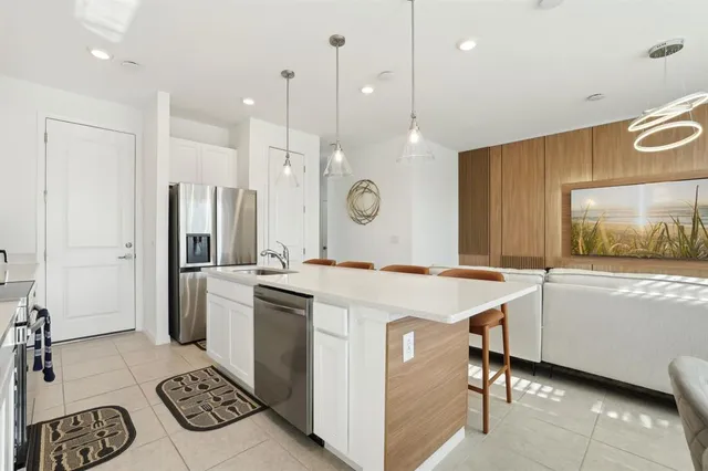 a kitchen that has a cabinets and a stove