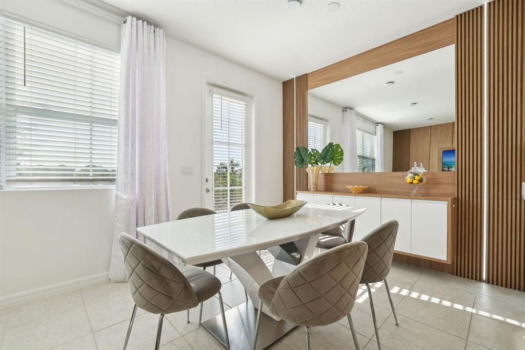 646 Longboat Drive Davenport, FL 33896 - Photo 27 of 41 a view of a dining room with furniture and window