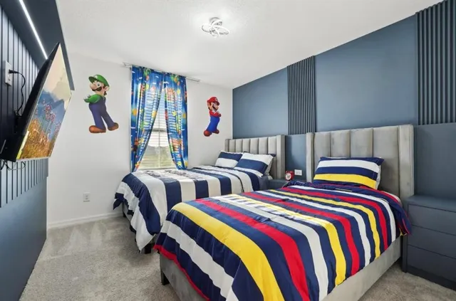 a bedroom with two beds and a closet