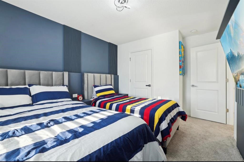 646 Longboat Drive Davenport, FL 33896 - Photo 36 of 41 a bedroom with two beds and a lamp