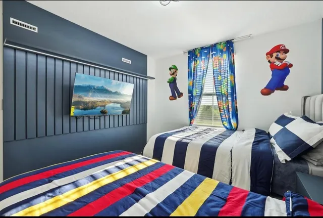 a bedroom with bed and a window