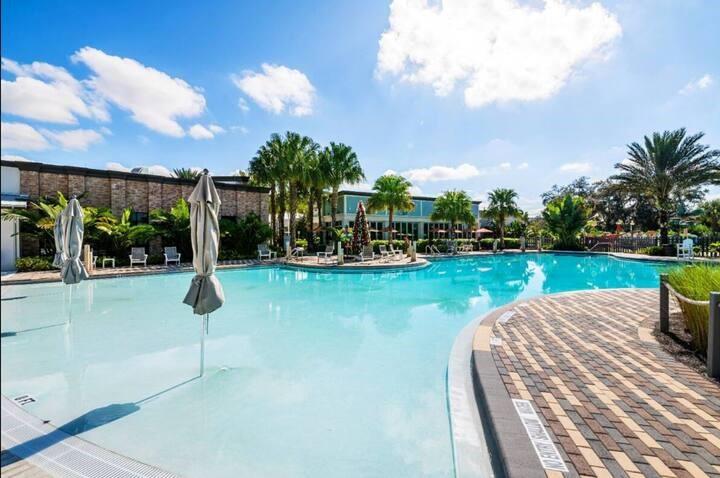 646 Longboat Drive Davenport, FL 33896 - Photo 6 of 41 a view of a lake with a house in the background