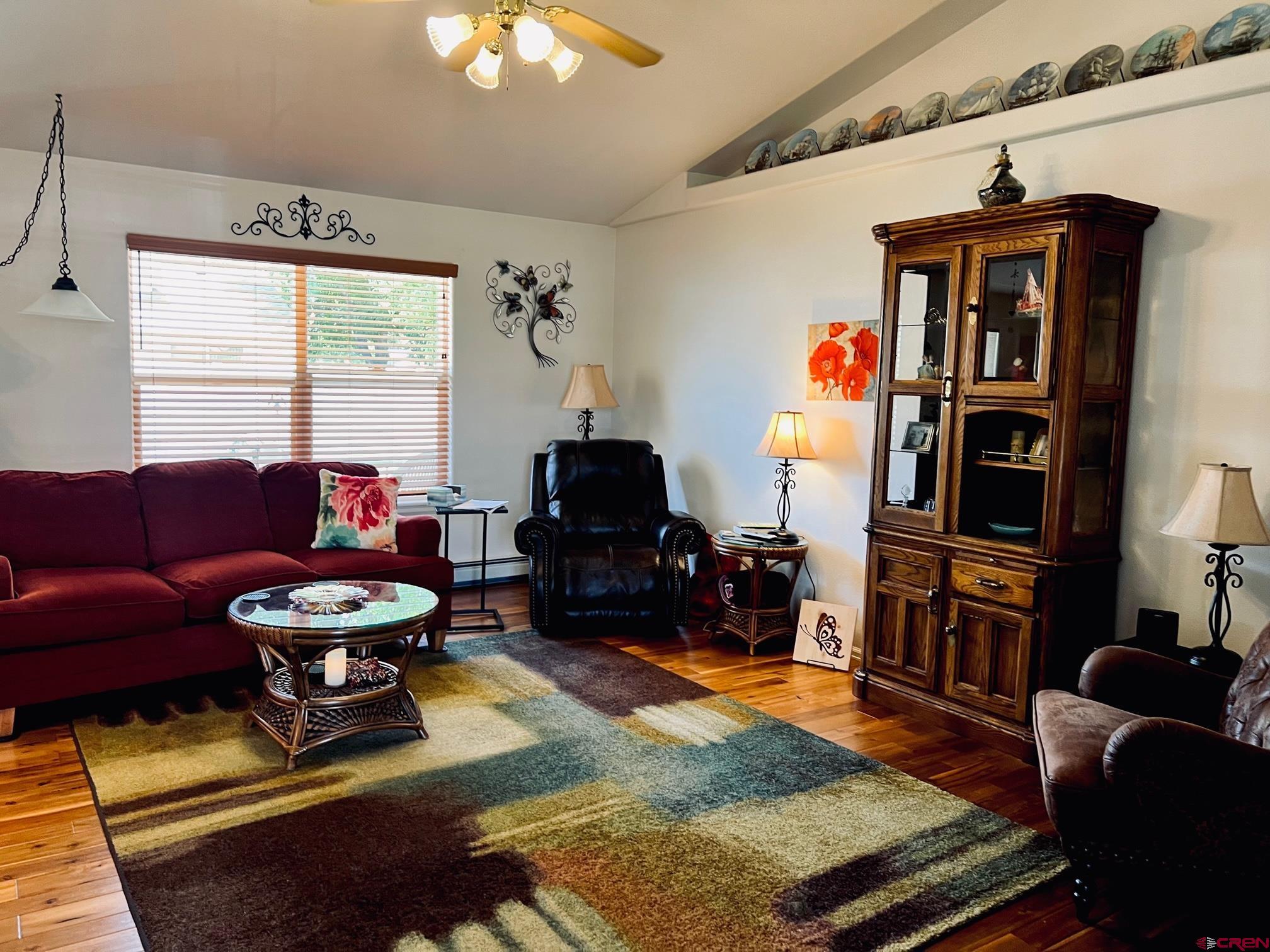 511 Hazel Circle Fruita, CO 81521 - Photo 11 of 24 a living room with furniture and a flat screen tv