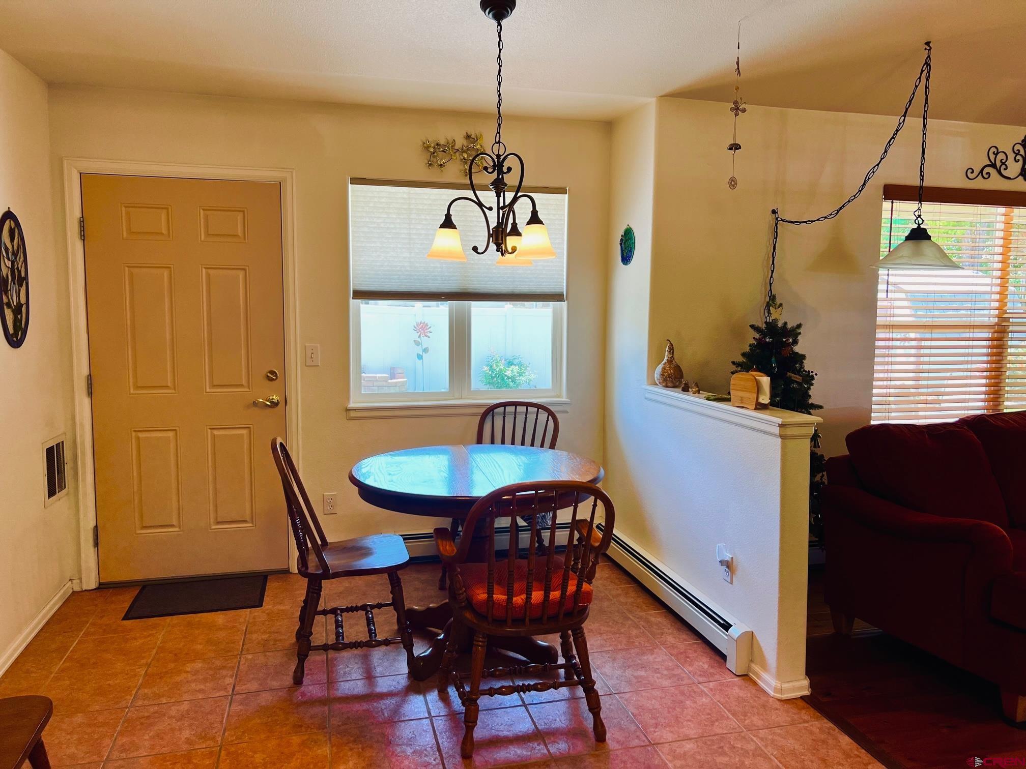 511 Hazel Circle Fruita, CO 81521 - Photo 14 of 24 a dining room with furniture and window