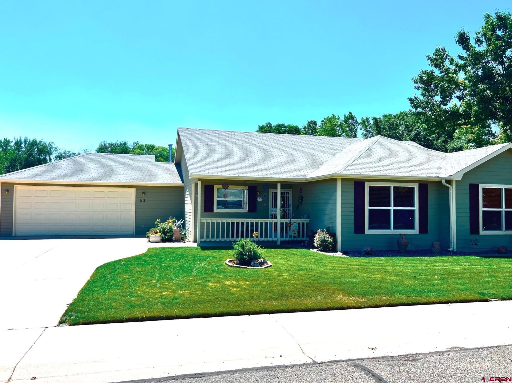 511 Hazel Circle Fruita, CO 81521 - Photo 2 of 24 a view of a yard in front of a house