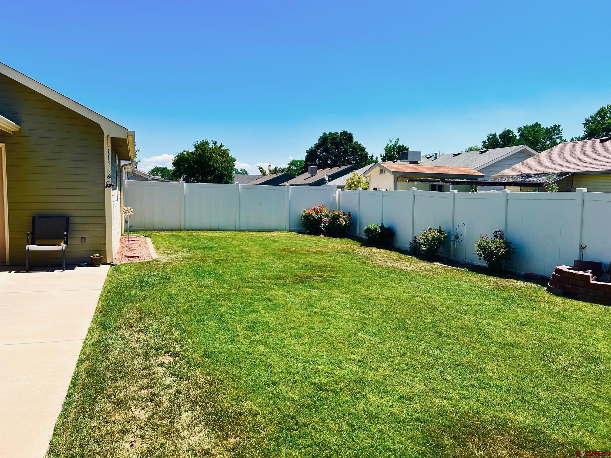 511 Hazel Circle Fruita, CO 81521 - Photo 6 of 24 a backyard of a house with lots of green space