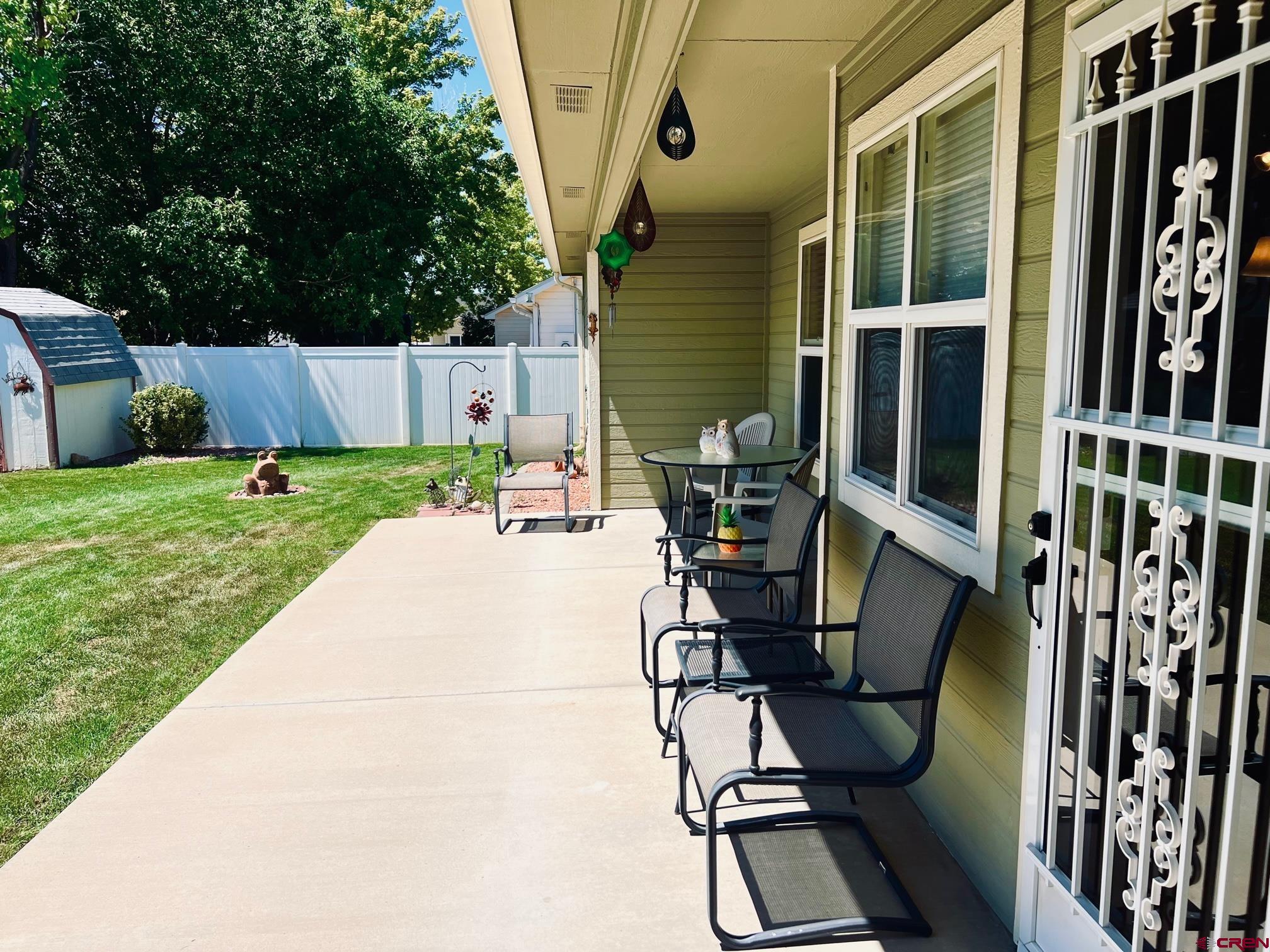 511 Hazel Circle Fruita, CO 81521 - Photo 7 of 24 a view of backyard with wheel chair and potted plants
