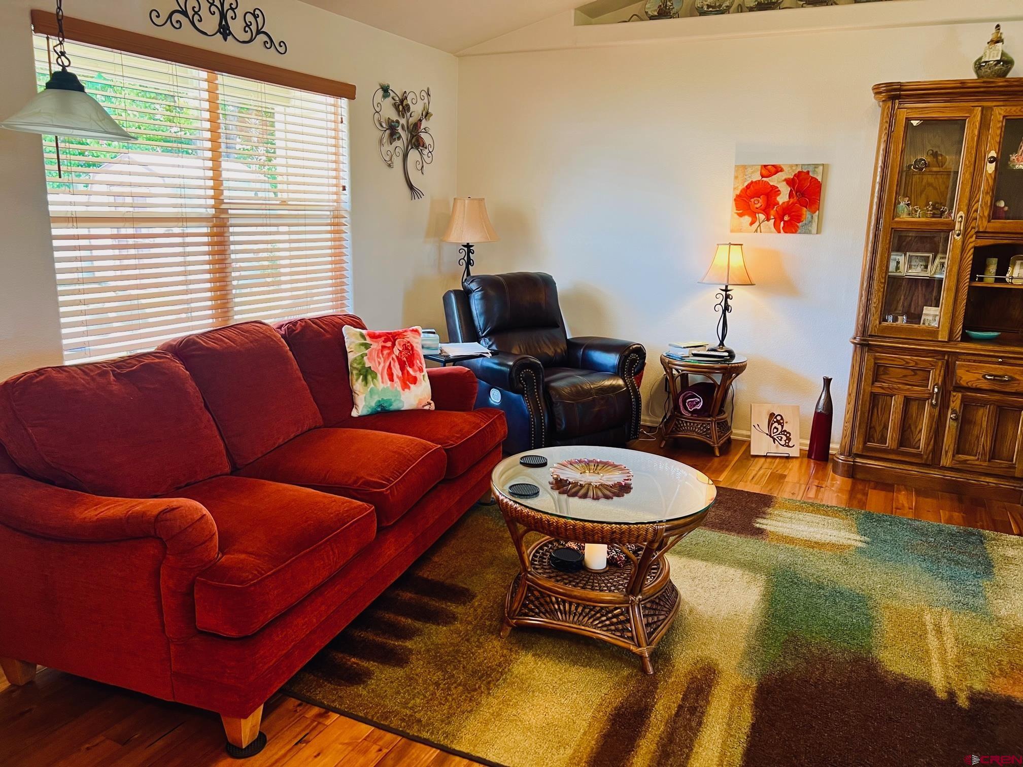 511 Hazel Circle Fruita, CO 81521 - Photo 10 of 24 a living room with furniture a rug and a window