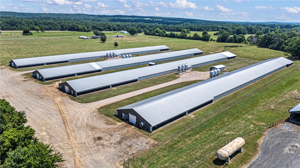 276 Charton Road Morrilton, AR 72110 - Photo 2 of 37 Multiple long agricultural buildings with metal roofs