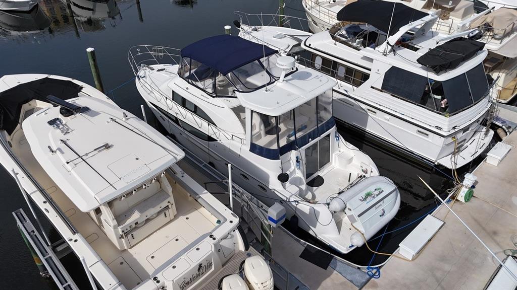 an aerial view of a house with roof deck and furniture