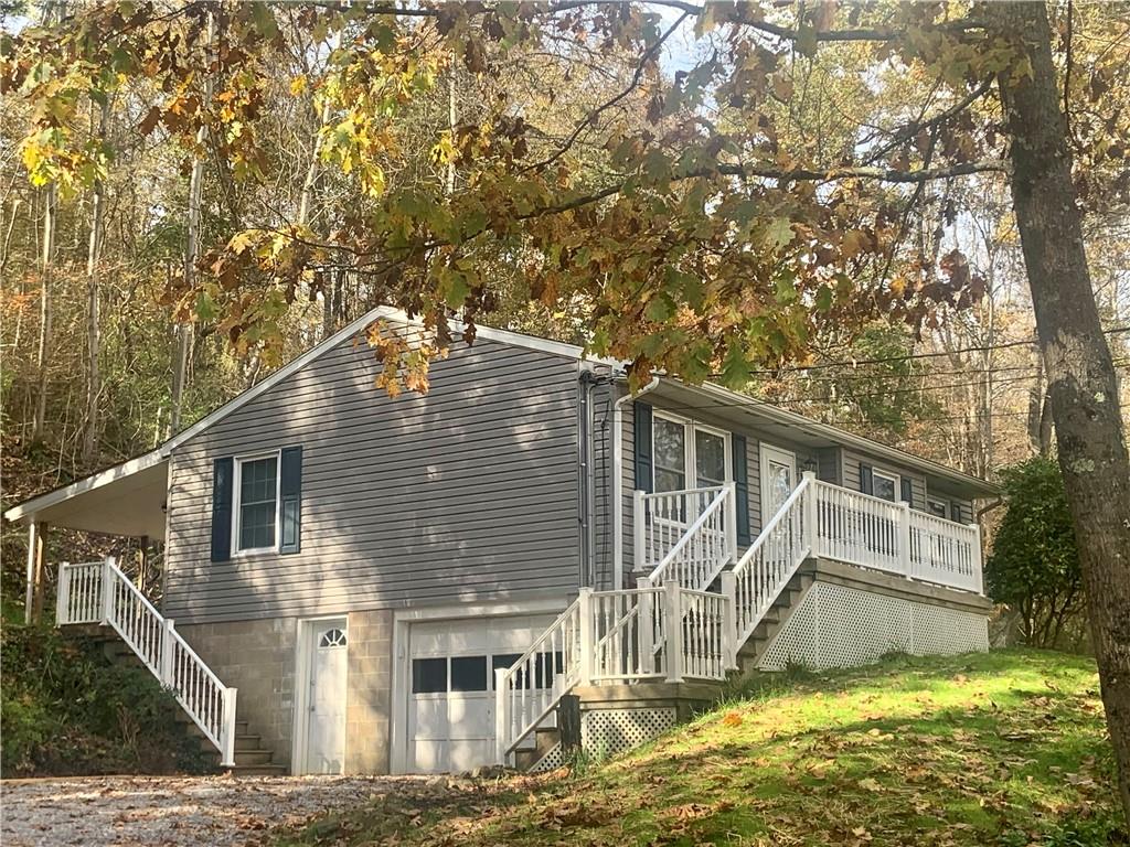 a view of house with yard