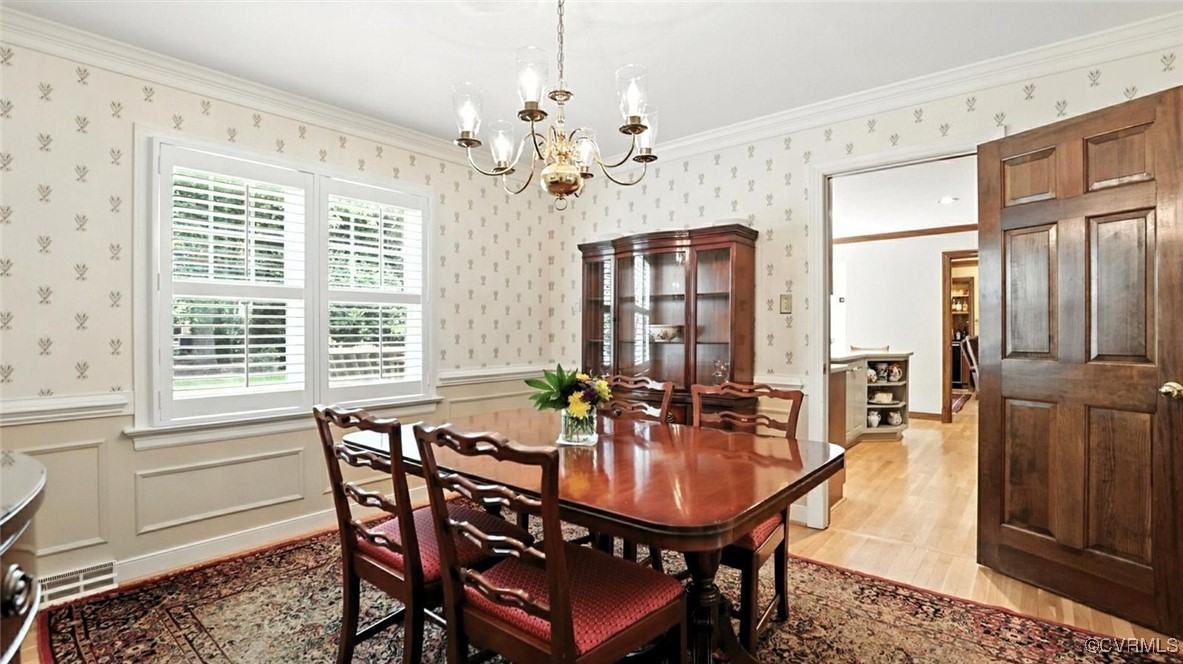 2601 Olde Stone Road Midlothian, VA 23113 - Photo 7 of 46 a dining room with furniture a chandelier and window