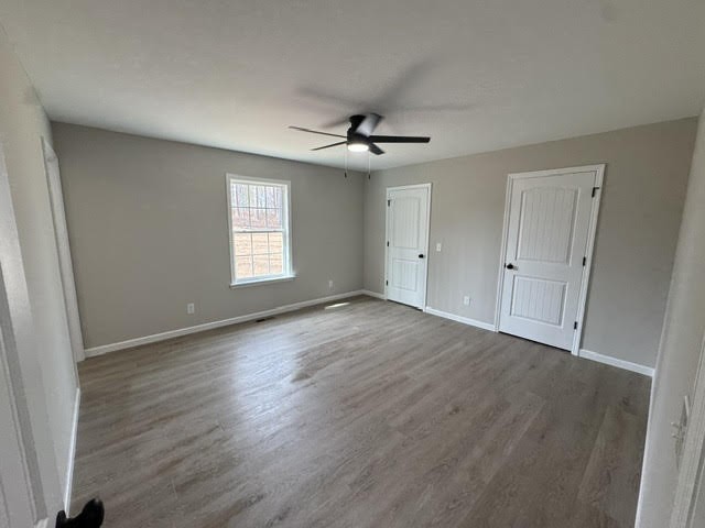 1267 Higginbotham Road McMinnville, TN 37110 - Photo 12 of 13 an empty room with wooden floor and windows