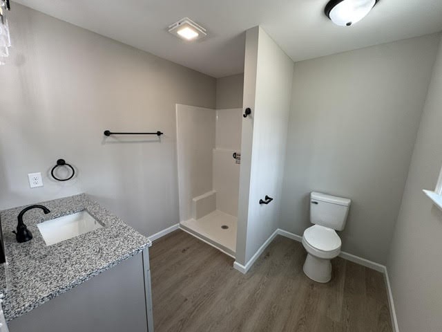 1267 Higginbotham Road McMinnville, TN 37110 - Photo 8 of 13 a bathroom with a granite countertop sink a toilet and a tub