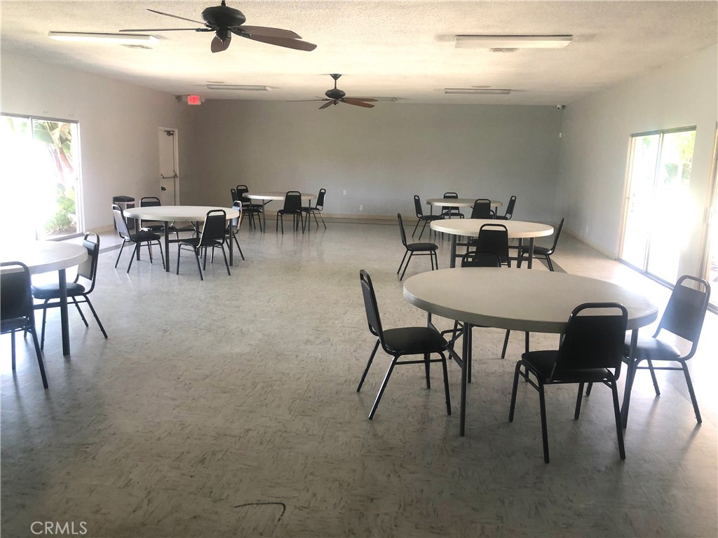 1560 Massachusetts Avenue, Unit 46 Riverside, CA 92507 - Photo 15 of 18 a dining room with furniture and window