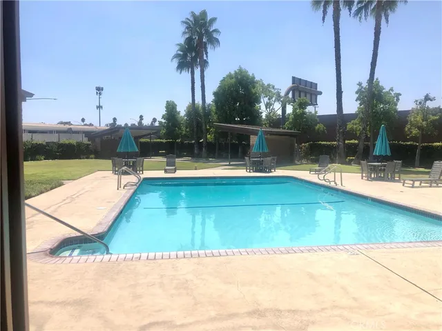 a view of swimming pool with a patio