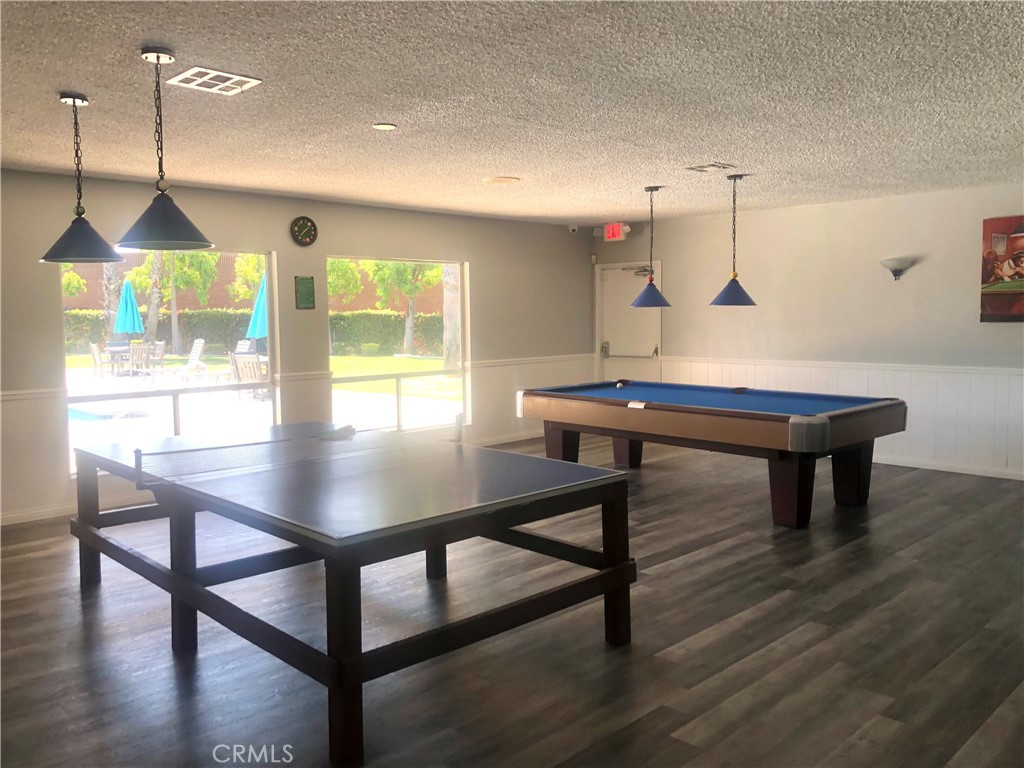 1560 Massachusetts Avenue, Unit 46 Riverside, CA 92507 - Photo 18 of 18 a view of a room with furniture and wooden floor