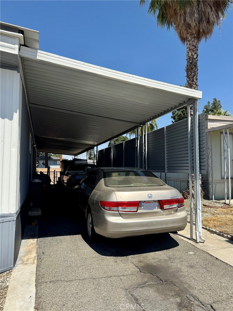 1560 Massachusetts Avenue, Unit 46 Riverside, CA 92507 - Photo 2 of 18 a car parked in front of house