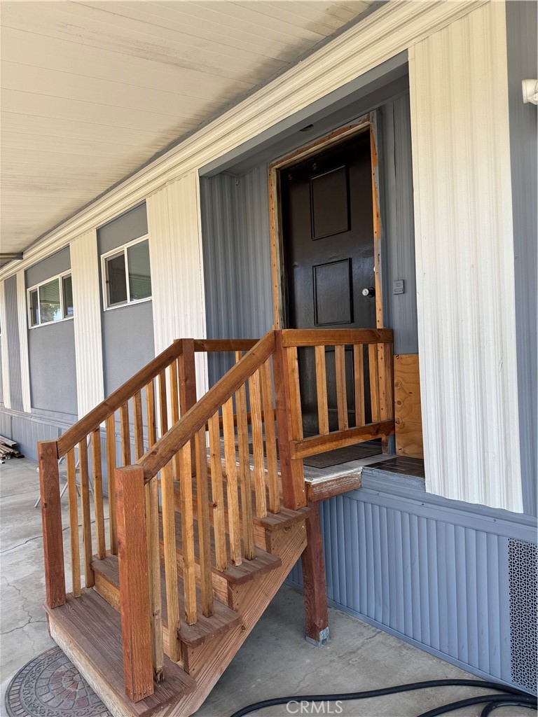 1560 Massachusetts Avenue, Unit 46 Riverside, CA 92507 - Photo 4 of 18 a view of staircase with railing and a window