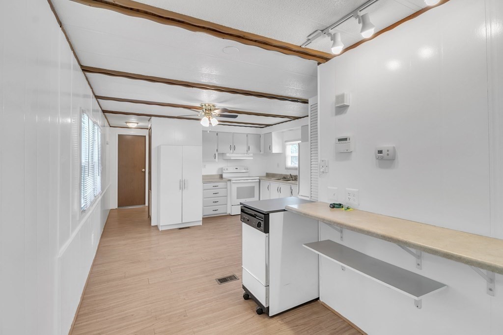 46 Contessa Lane Springfield, MA 01119 - Photo 11 of 25 a room with white cabinets and wooden floor