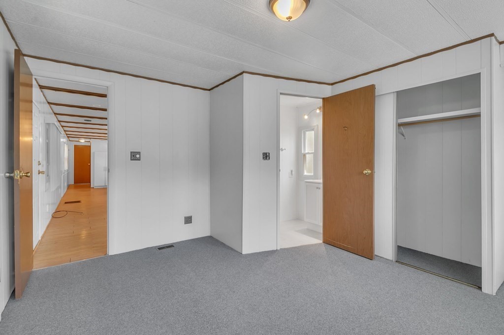 46 Contessa Lane Springfield, MA 01119 - Photo 14 of 25 a view of a room with a walk in closet and wooden floor