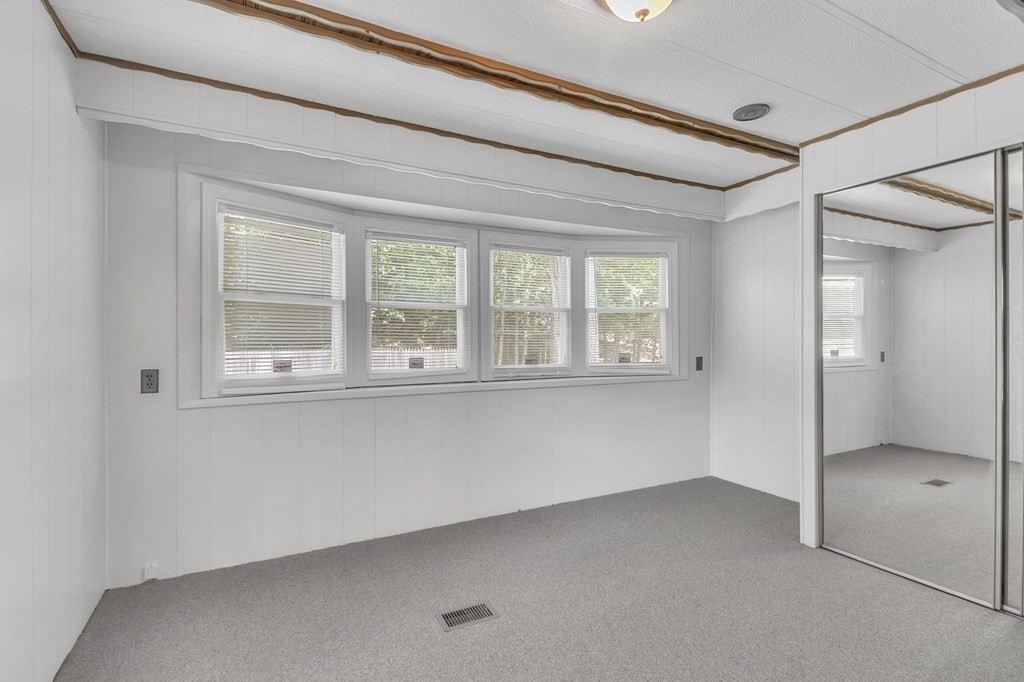 46 Contessa Lane Springfield, MA 01119 - Photo 17 of 25 a view of an empty room with a window