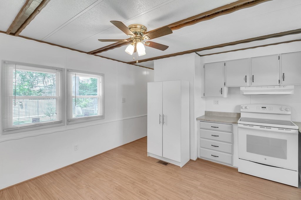 46 Contessa Lane Springfield, MA 01119 - Photo 5 of 25 a view of a stove and cabinets in a room