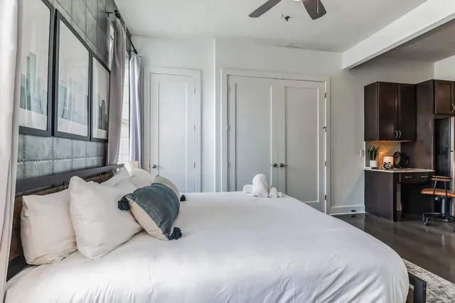 a living room with fireplace furniture and a flat screen tv