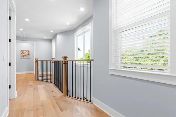 a bedroom with a bed and a potted plant