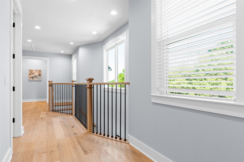421 Proctor Avenue Waco, TX 76708 - Photo 11 of 28 a view of a hallway with wooden floor and windows