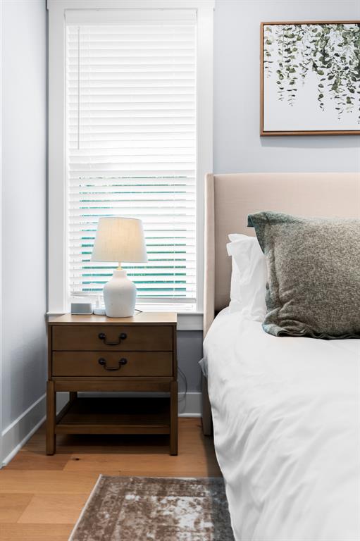 421 Proctor Avenue Waco, TX 76708 - Photo 18 of 28 a bed sitting in a bedroom next to a window