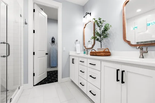 a bedroom with a bed couch and window