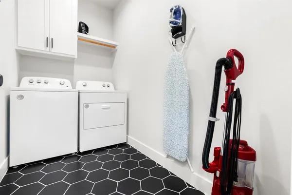 a bedroom with a bed couch and window