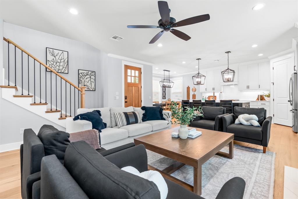 421 Proctor Avenue Waco, TX 76708 - Photo 3 of 28 a living room with furniture a clock and a view of kitchen