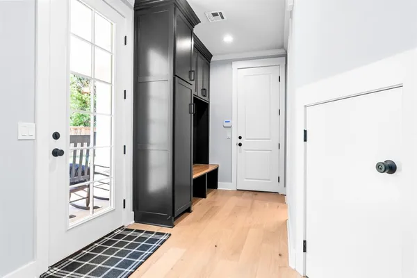 a bathroom with a tub shower and sink