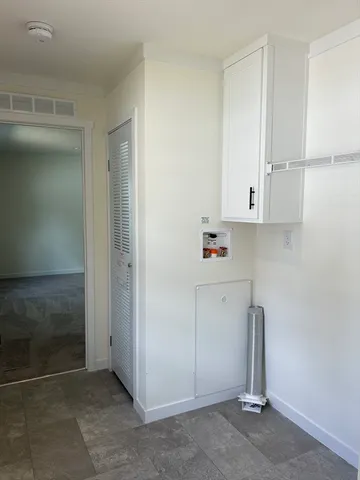 a view of cabinets and window