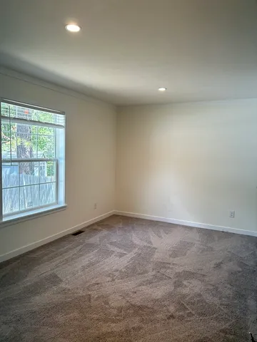 an empty room with a empty space and window